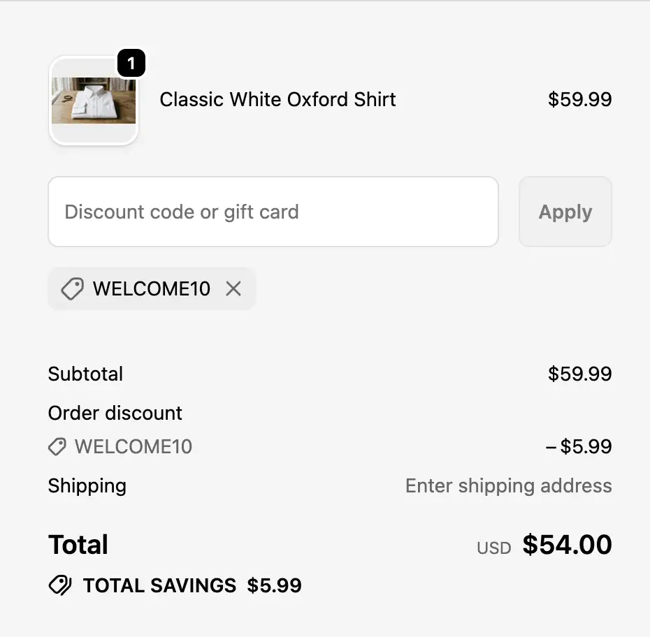 A Shopify checkout page with a discount code field and the applied discount shown in the order summary.